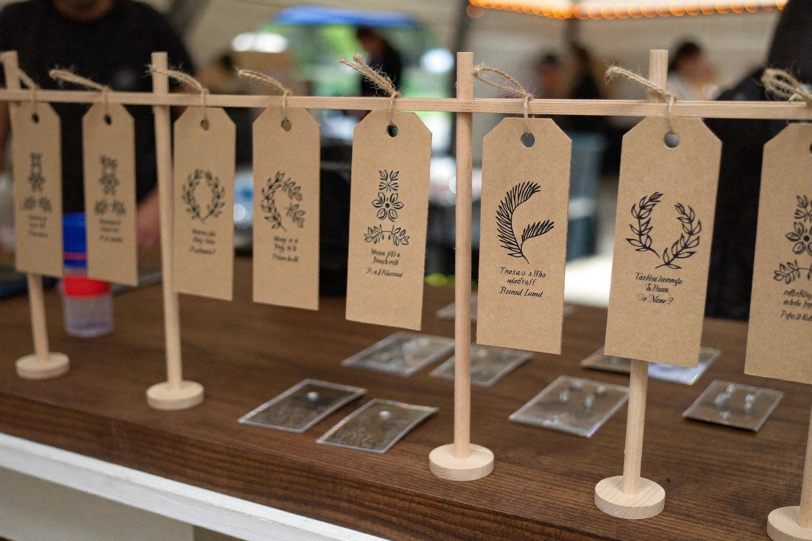 A craft-fair stall of finished laser-cut pieces.