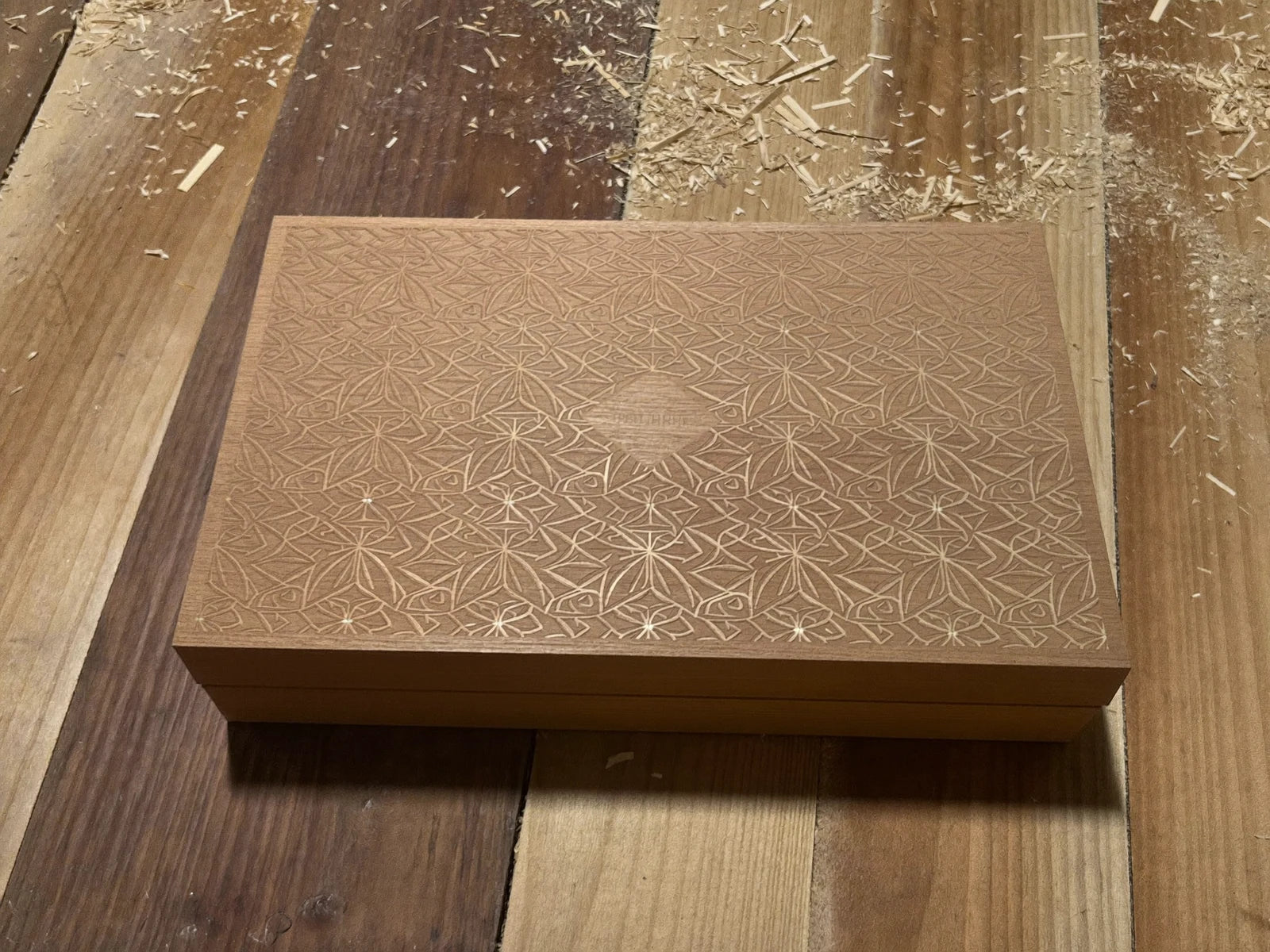 Engraved laser-cut wooden gift box.